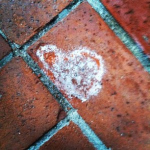 a #Signoflove in a broken down brick